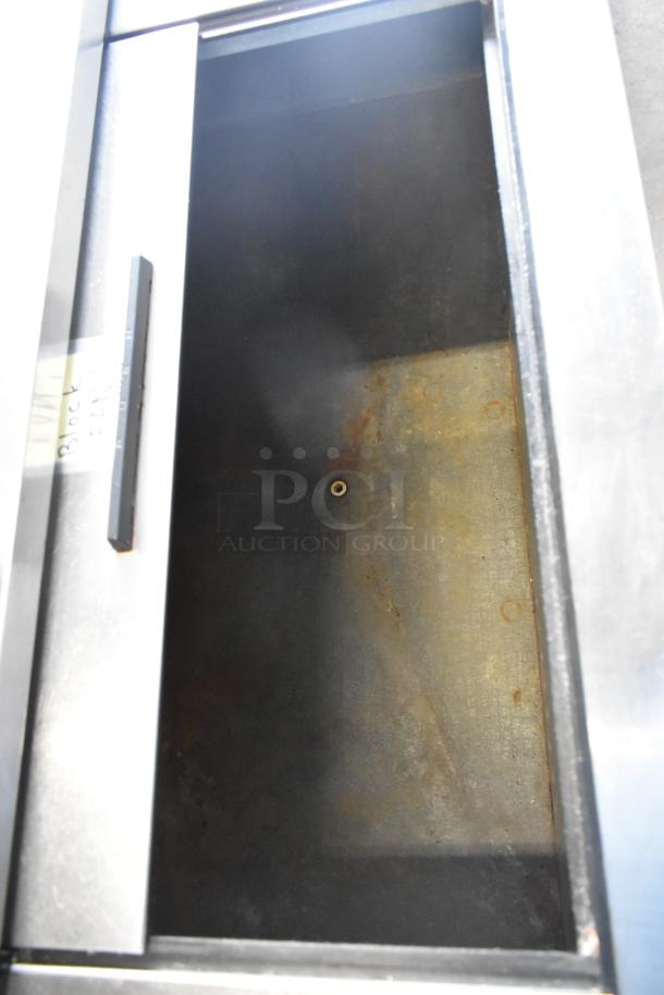 Beverage Air DW79 stainless steel back bar bottle cooler with 3 sliding lids, visible inside. 115 volts, 1 phase.