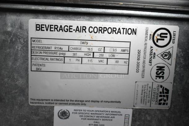 Beverage Air DW79 stainless steel back bar bottle cooler, 3 sliding lids, 115 volts, commercial use, specifications label visible.