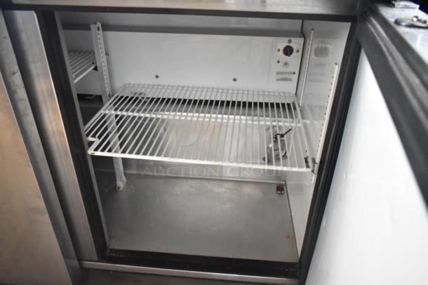 True TUC-48F-LP stainless steel commercial undercounter freezer, two doors, interior shelving, 115 volts, 1 phase.