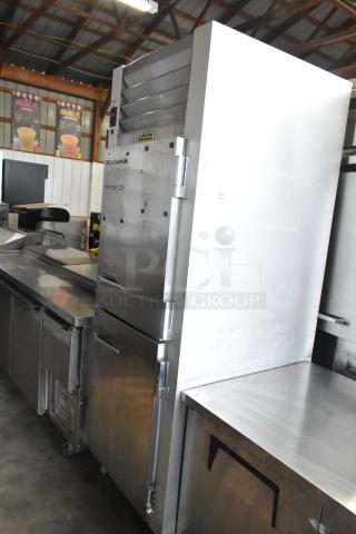 Traulsen G12000 stainless steel reach-in freezer with two half-size doors, poly-coated racks, 115V, 1 phase.