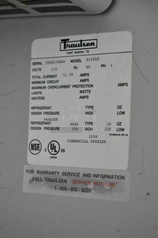 Traulsen G12000 label shows specs for 115V, 1 phase. UL and NSF certified. Warranty service contact information included.