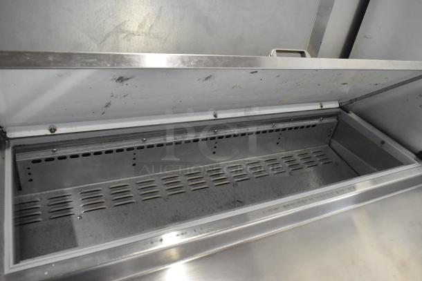 2016 Continental CPA93 stainless steel pizza prep table on commercial casters, open lid, showing stainless interior.