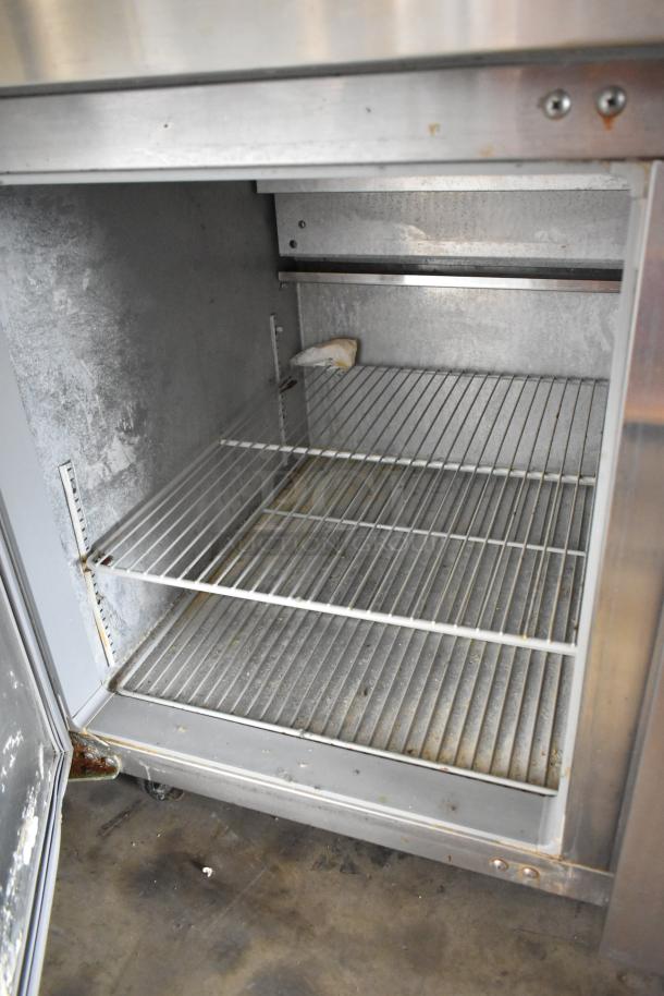 2016 Continental CPA93 stainless steel pizza prep table, commercial casters, visible wear, 115V, 1 phase, model tag.