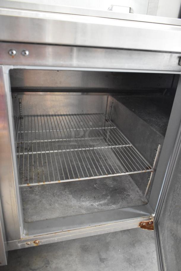 2016 Continental CPA93 stainless steel pizza prep table, stainless finish, commercial casters, interior shelving, used condition.