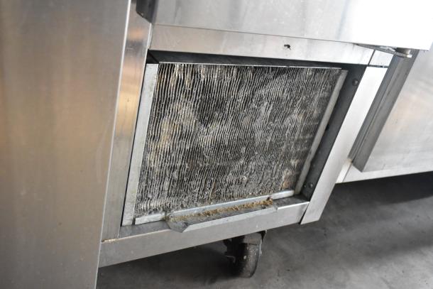 2016 Continental CPA93 stainless steel pizza prep table on casters, visible wear, 115V, 1 phase, filter panel shown.