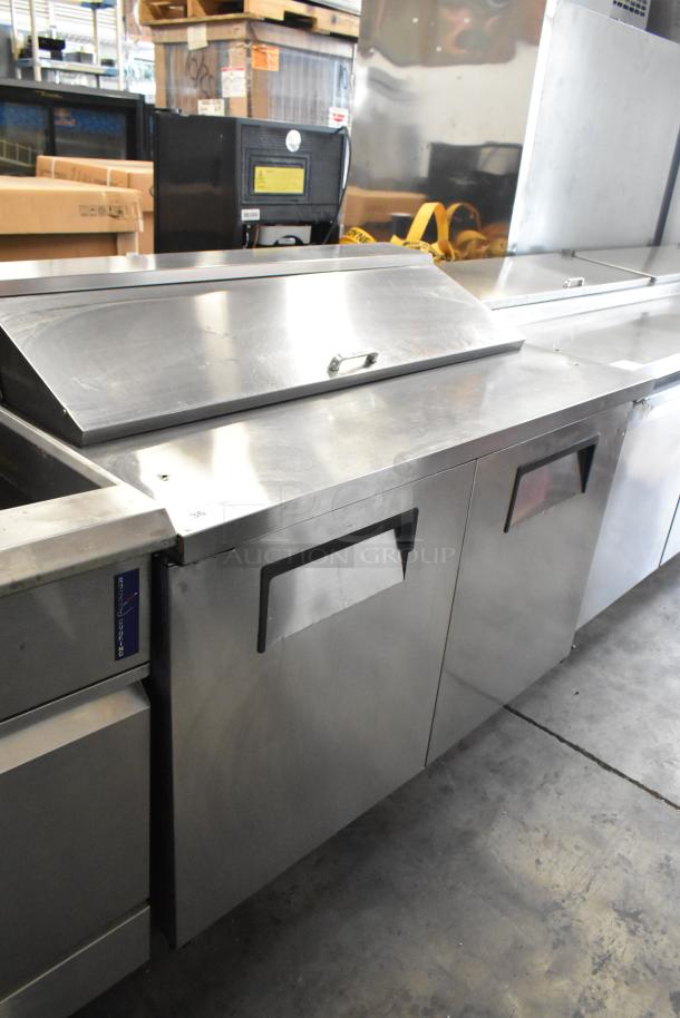 True TSSU-48-12 stainless steel sandwich salad prep table, commercial casters, 115V, 1 phase, excellent condition.
