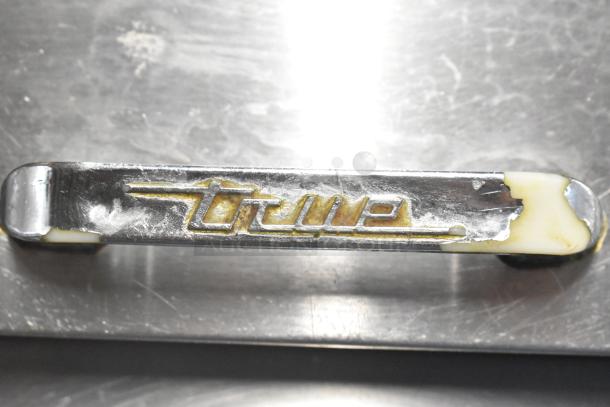 True TSSU-48-12 stainless steel handle with logo showing wear, part of a commercial sandwich salad prep table.