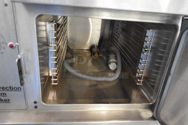 Market Forge 3500 stainless steel 2-deck steam cabinet, natural gas, 170,000 BTU, interior view, Model M24GIA steam generator.