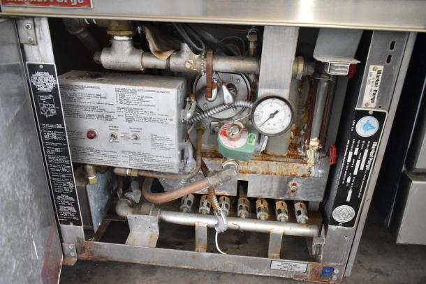 Market Forge 3500 stainless steel steam cabinet, natural gas powered, on M24GIA steam generator, 170,000 BTU. Visible gauges and labels indicate operational instructions and specifications.