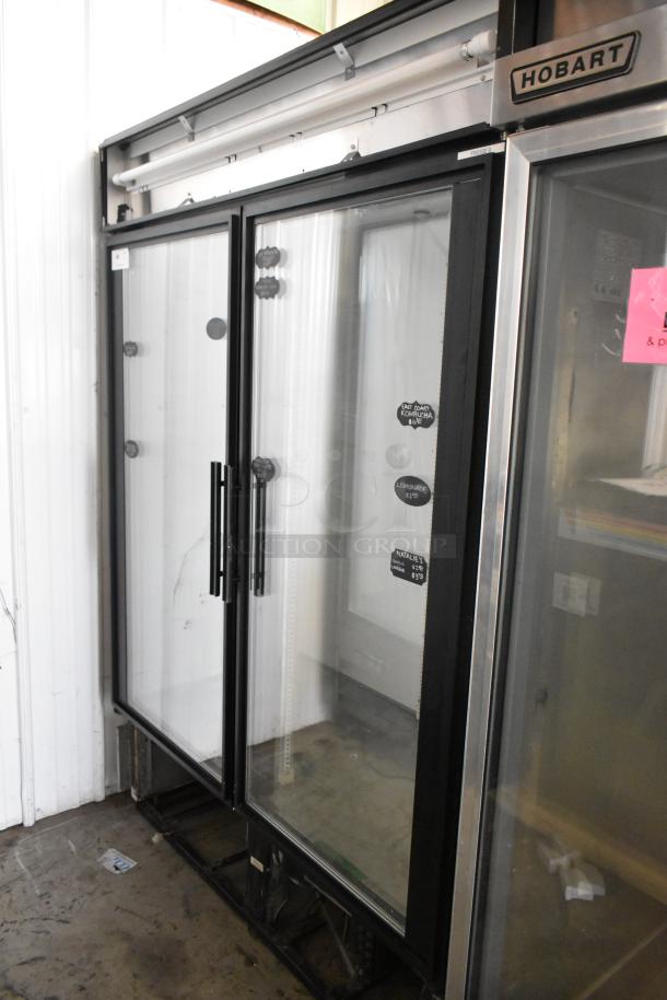 True GDM-49 commercial 2-door cooler, glass front, metal frame, 115 volts, 1 phase, clean condition, visible tags.