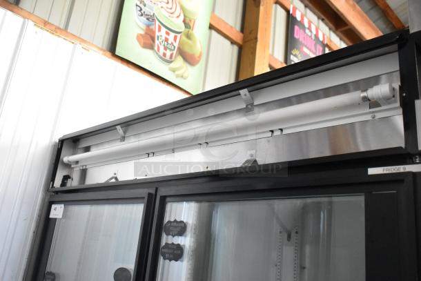 True GDM-49 2-door commercial reach-in cooler, metal exterior, 115V, 1-phase, visible interior lighting, label reads "Fridge 9".