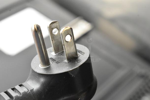 Close-up of a power plug for a 2019 True GDM-05-HC-LD Mini Cooler. Plug shows 115 volts, 1 phase markings.