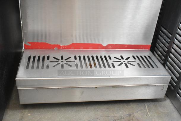 APW Wyott FC-14D stainless steel commercial beverage dispenser, countertop model, 120V, visible wear on base.