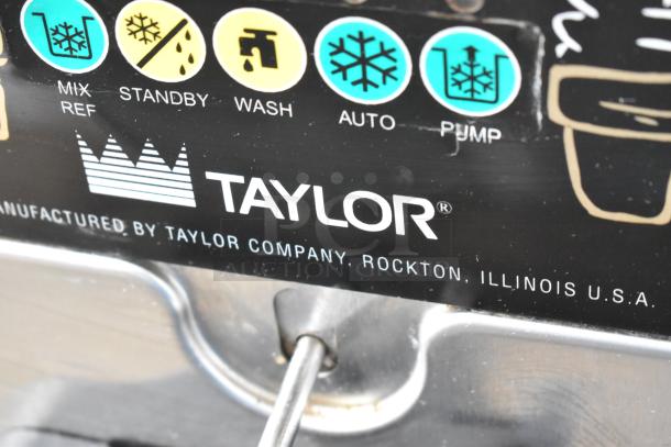 Taylor C706-27 stainless steel soft serve ice cream machine, buttons labeled Mix, Standby, Wash, Auto, Pump, 208-230V, 1 Phase.