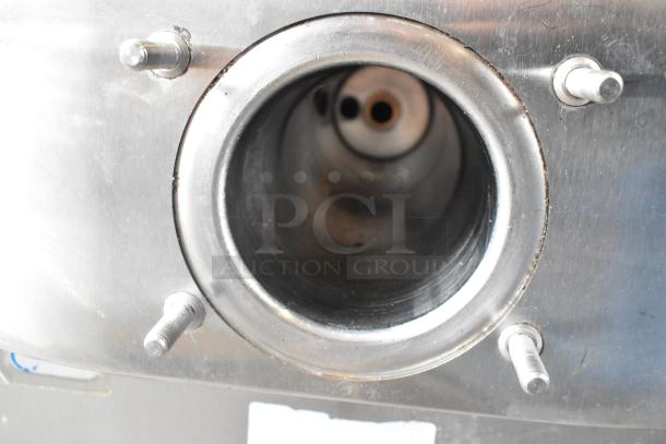 Stainless steel opening of Taylor C706-27 soft serve ice cream machine, showing internal components. Clean condition.