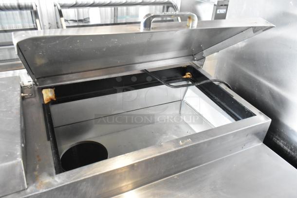 True TPP-67 stainless steel pizza prep table with lift-up lid, commercial casters, 115V, 1 phase, good condition.