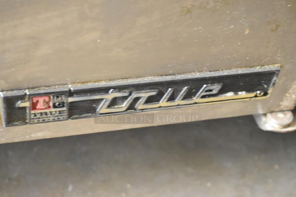 True TPP-67 Stainless Steel Pizza Prep Table, features include commercial casters, 115 volts, 1 phase, seen with brand logo.
