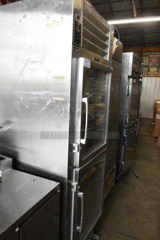 Traulsen RHT132WPTHHG stainless steel commercial refrigerator with 2 half glass doors. 115V, 1 phase. Used condition.
