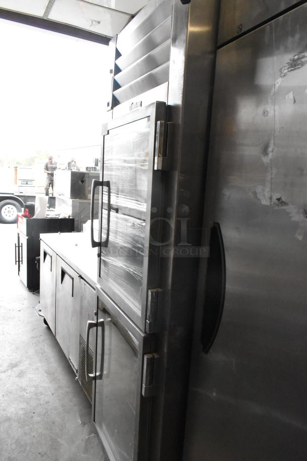 Traulsen RHT132WPTHHG stainless steel commercial refrigerator, 2 half doors, reach-in, 115 volts, side view.