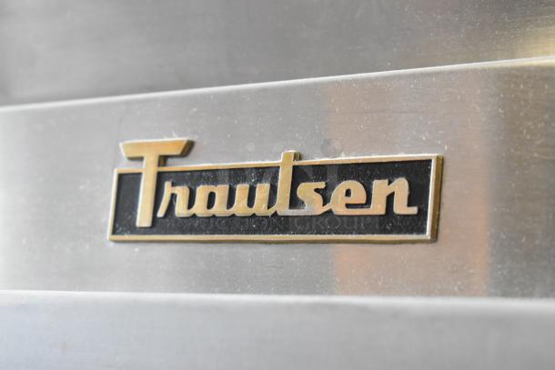 Traulsen stainless steel logo plate on the RHT132WPTHHG commercial refrigerator.