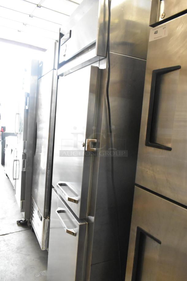 Traulsen stainless steel commercial cooler with 2 half-size doors, on casters. 115V, 1 phase, in good condition.