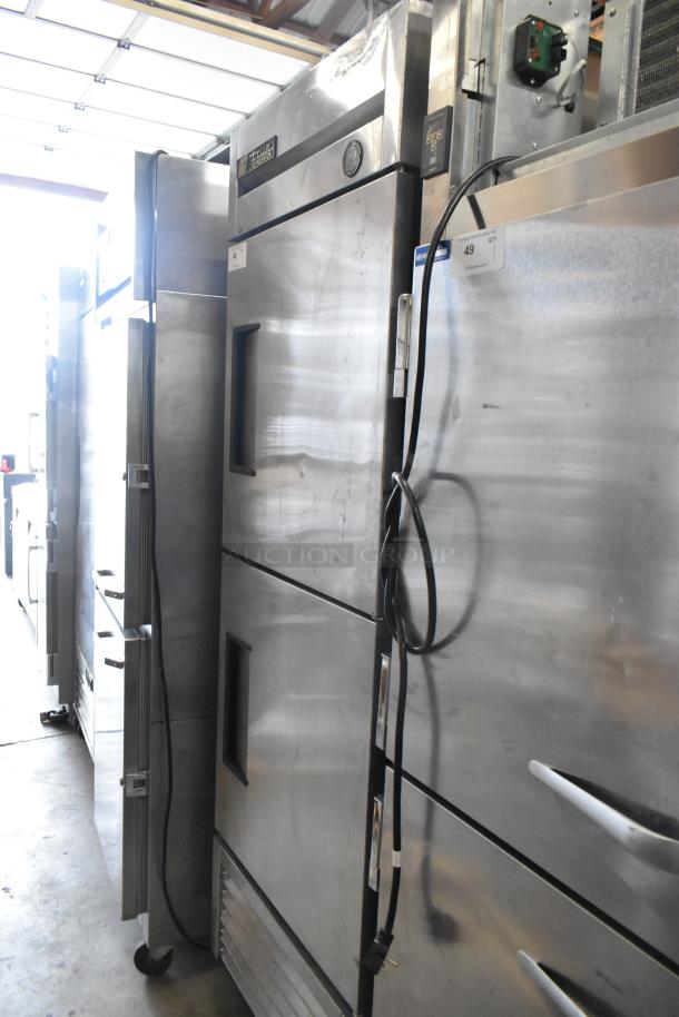 True T-23-2 stainless steel commercial cooler, 2 half doors, on casters, 115 volts, 1 phase, visible control panel.