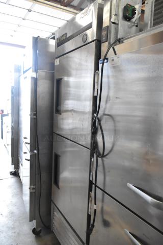 True T-23-2 stainless steel commercial cooler, 2 half doors, on casters, 115 volts, 1 phase, visible control panel.