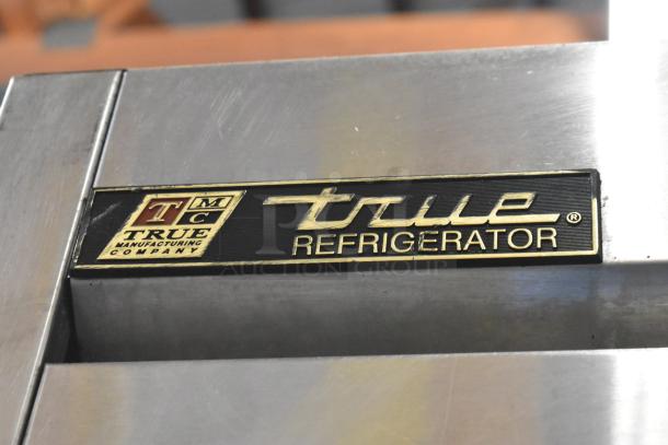 True T-23-2 stainless steel commercial reach-in cooler label with logo. Model info etched, indicating quality make.