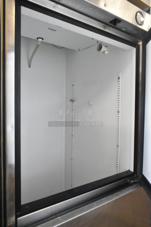 True T-23-2 commercial cooler, stainless steel, two half-size doors, on casters, 115 volts, 1 phase, interior view.