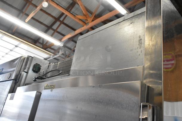 2018 Traulsen ALT232NUT-HHS stainless steel reach-in cooler with 4 half-size doors, on commercial casters. 115V, 1 phase.