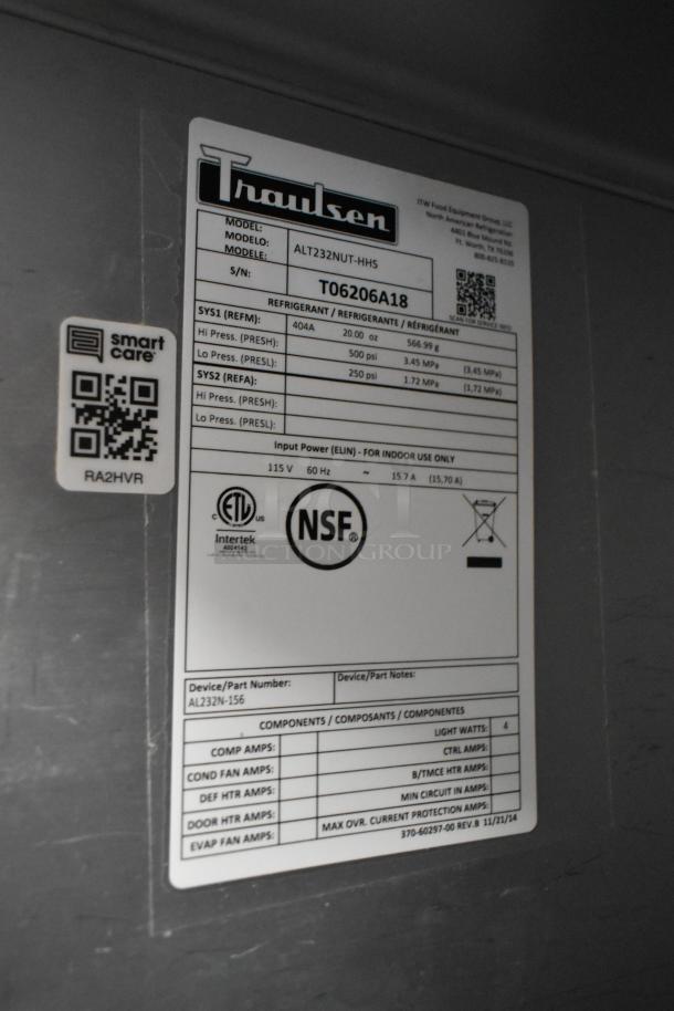 Traulsen ALT232NUT-HHS stainless steel commercial cooler, 4 half doors, on casters, 115V, NSF and ETL certified label visible.