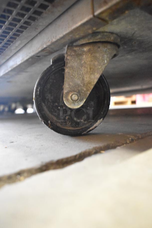 Continental CFB42 undercounter freezer caster wheel, showing durable construction and mobility component.