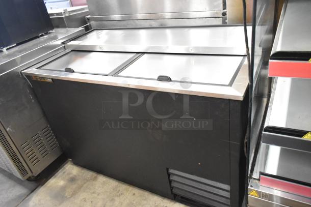True TD-50-18 stainless steel back bar bottle cooler with two sliding lids, 115V, 1 Phase, visible True branding, good condition.