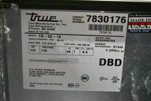 True TD-50-18 back bar bottle cooler label, showing model, voltage (115V), refrigerant type, NSF and UL certifications.