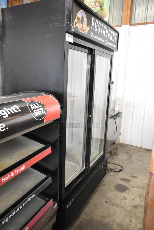 Kool It KSM-36 commercial cooler; 2 doors, poly-coated racks, 115V, 1 phase, black metal, clear glass front, used condition.