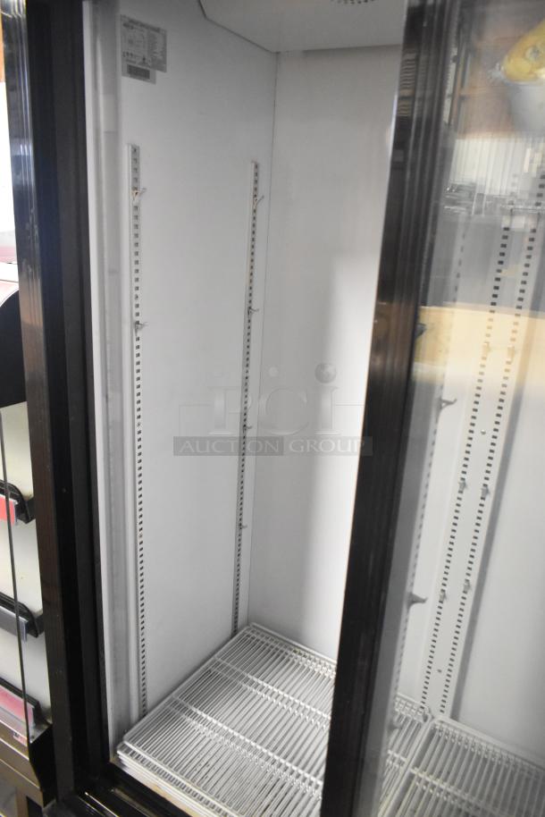 Kool It KSM-36 metal commercial 2-door reach-in cooler with poly-coated racks, 115V, in good condition.