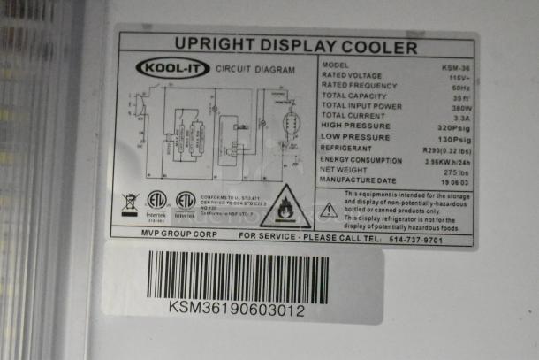 Kool It KSM-36 2-Door Cooler, 115V, commercial use, metal, poly-coated racks, model info label visible with specs.