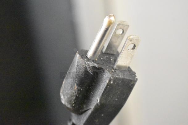 Close-up of a power plug for Frigidaire EFRF696-AMZ-6COM Stainless Steel Single Door Reach In Freezer, 115 Volts.