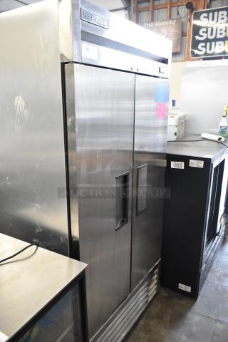 2021 True T-35-HC stainless steel commercial 2-door reach-in cooler, poly-coated racks, 115V, 1 phase, excellent condition.