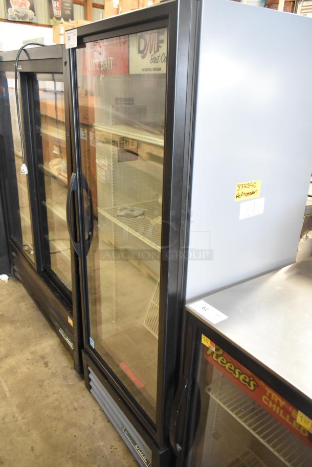 2024 True GDM-12-HC single door cooler with poly coated racks, black metal finish. 115V, 1 phase. Label: "Refrigeration".