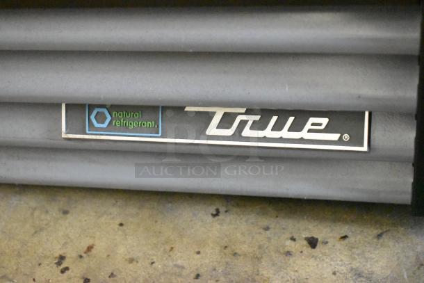 True GDM-12-HC cooler label displaying "True" logo and "natural refrigerant" marking, highlighting energy efficiency.