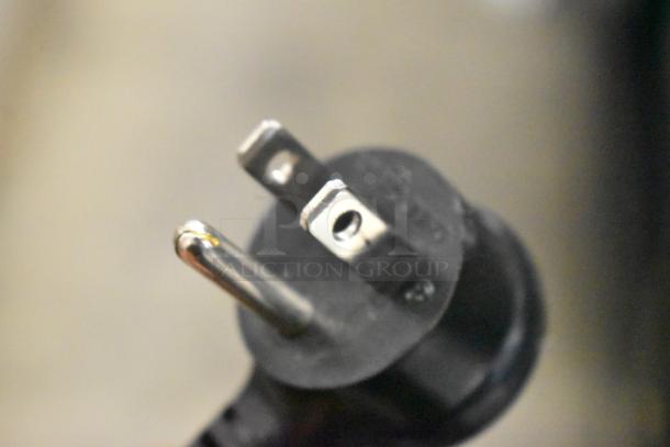 Close-up of a 3-prong electrical plug for the 2024 True GDM-12-HC Mini Cooler Merchandiser, 115V, 1 Phase.