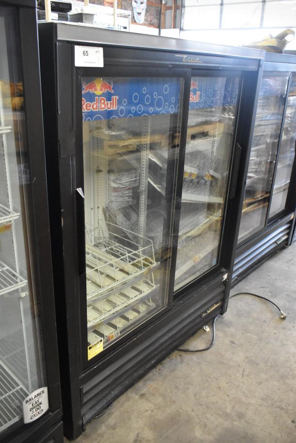 True GDM-41SL-60-HC-LD 2-door mini cooler merchandiser with poly coated racks, metal frame, visible Red Bull branding.
