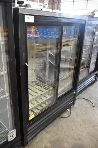 True GDM-41SL-60-HC-LD 2-door mini cooler merchandiser with poly coated racks, metal frame, visible Red Bull branding.