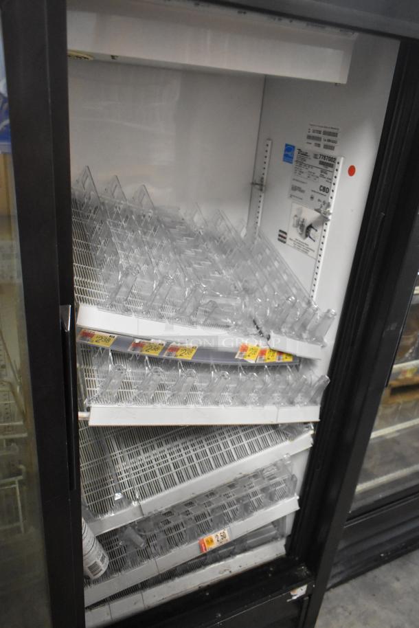 True GDM-41SL-60-HC-LD 2-door mini cooler merchandiser with poly coated racks; 115 volts, 1 phase; interior labels visible.