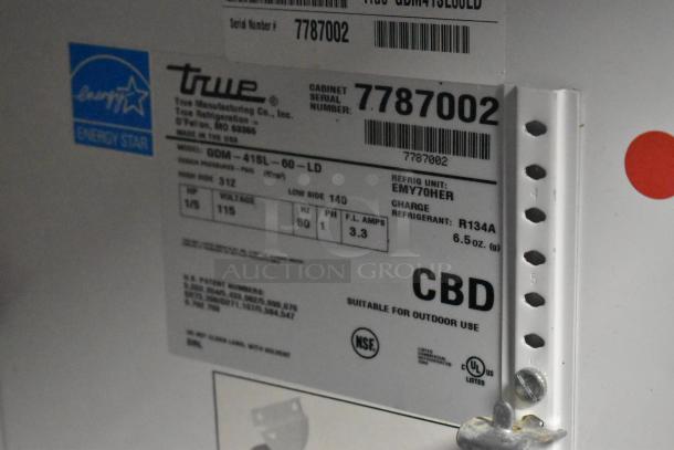 True GDM-41SL-60-HC-LD metal merchandiser label. Shows model, voltage (115V), and refrigerant (R134A). Energy Star certified.
