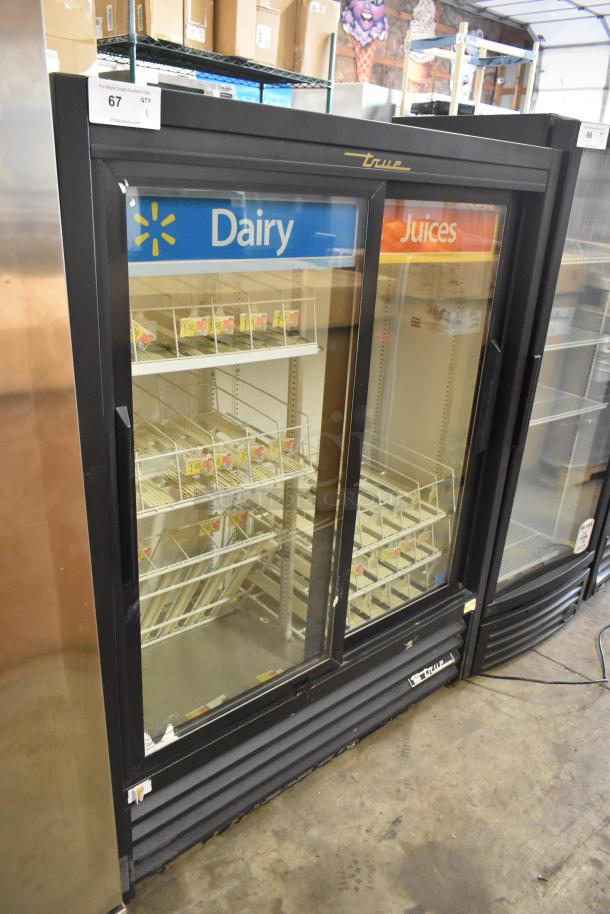 2022 True GDM-41SL-60-HC-LD commercial 2-door cooler, poly coated racks, 115V, good condition, Dairy and Juices sign.