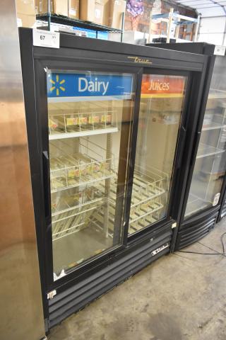 2022 True GDM-41SL-60-HC-LD commercial 2-door cooler, poly coated racks, 115V, good condition, Dairy and Juices sign.
