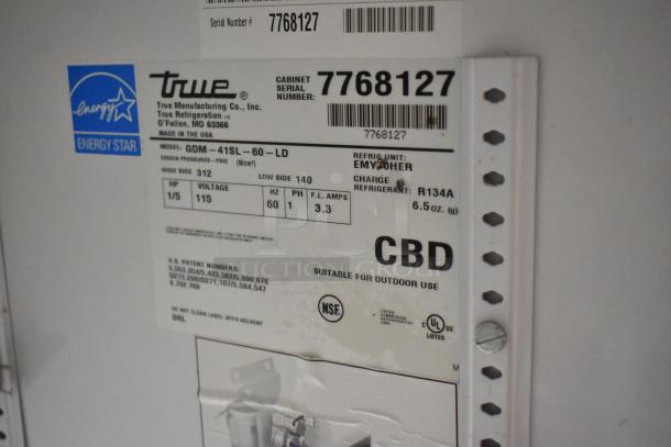 2022 True GDM-41SL-60-HC-LD metal commercial cooler label with model, voltage, and refrigerant details.