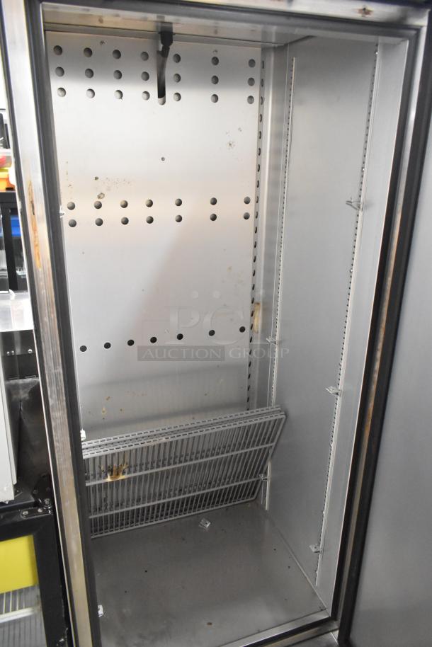 2022 True T-19F-HC stainless steel commercial freezer, single door, poly coated racks, 115V, 1 phase, interior view.